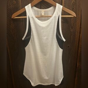Tank mesh with black netting. Unique unsure of brand. Worn once like new xs